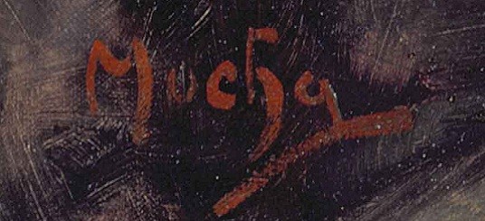 Signature in red paint on a dark background
