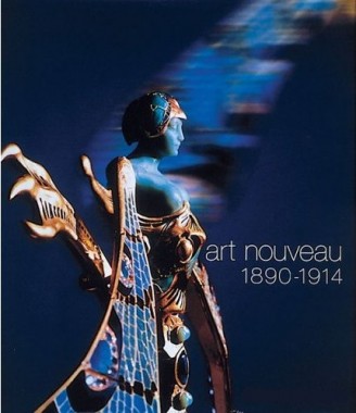 Art Nouveau, 1890-1914 A jewellery piece of a blue figure with decorative blue and gold wings on a dark blue background with the title of the exhibition in the middle towards the right