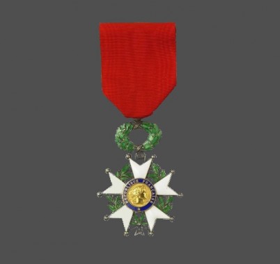 Chevalier de la légion d'honneur Medal with five prongs surrounded by a foliage wreath on a red ribbon