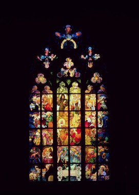 Stained-glass Window designed by Mucha at St. Vitus Cathedral, Prague A central panel surrounded by 36 panels seen from the interior of the cathedral