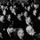 General Assembly of the League of Nations Men of different nationalities, some with headphones, seated in a conference room